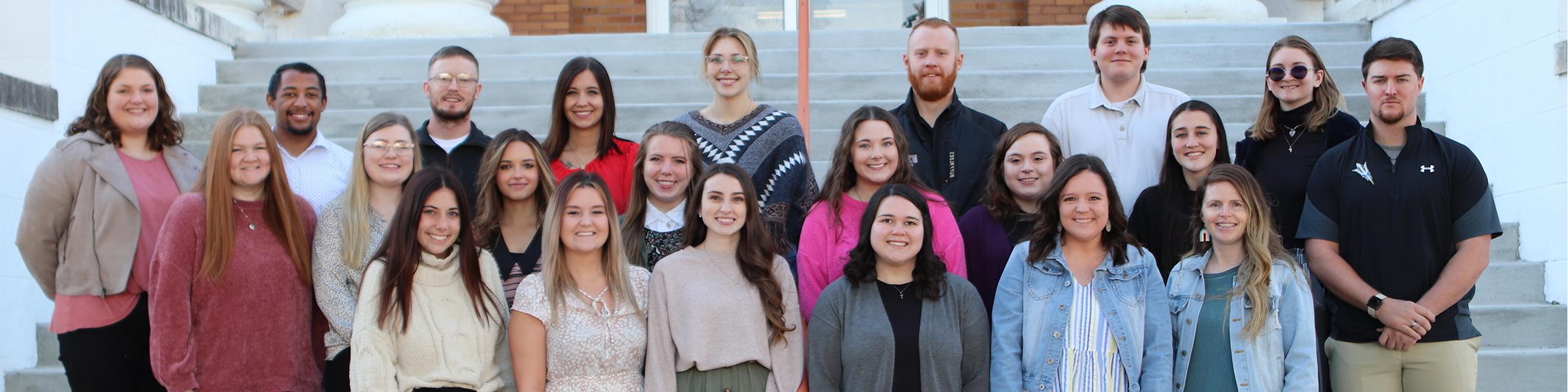 Spring 2022 Student Teachers standing on the step of Science Hall